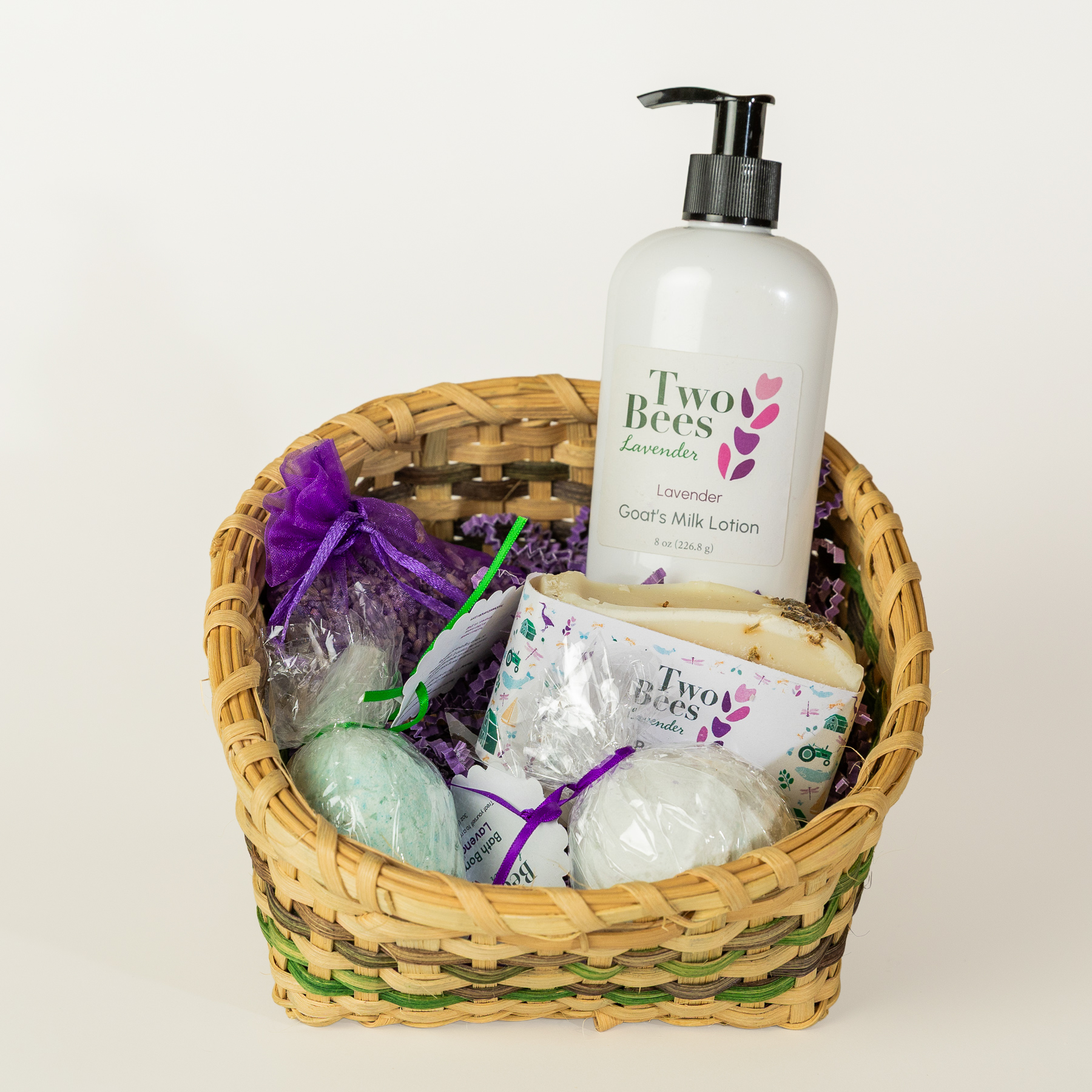 Lavender Essentials Gift Basket with lavender lotion, soap, sachet, and bath bombs in a handmade basket