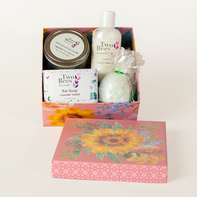Lavender gift box with lavender soap, lotion, candle, and bath bomb in a decorative box